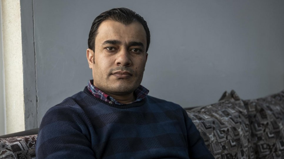 Dr. Mohammed Issa, 33, from Al-Hasakah in northern Syria, relaxes at home in Erbil, capital of the Kurdistan Region of Iraq, after a long day visiting patients.