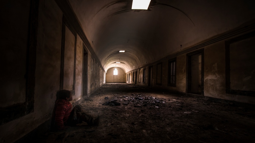 One of Ahmed's photos illustrates a child waiting alone in a bombed-out Church. 