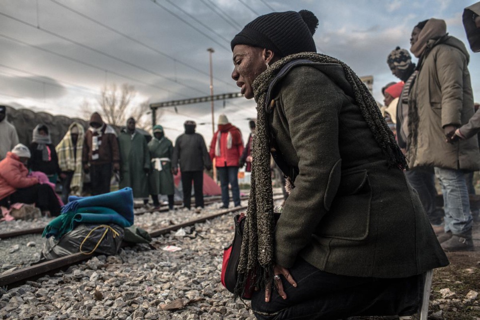 Elisabeth, from Congo, leads a prayer circle in Idomeni, Greece. "Life is not for those who easily give up," she preached.