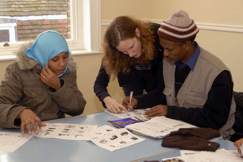 These Ethiopian refugees are receiving a language lesson after being resettled in the United Kingdom.