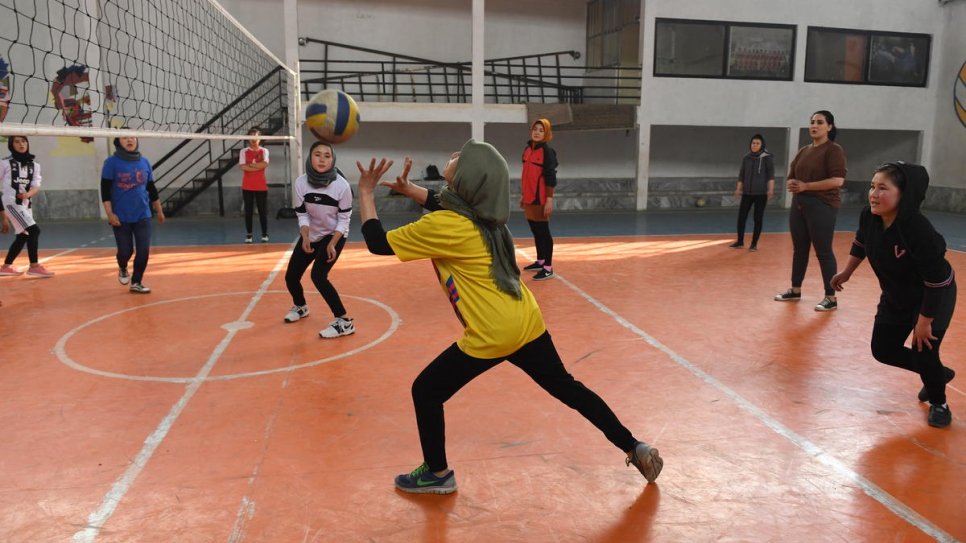 Twenty-seven-year-old Afghan returnee Kobra Yusufy attends volleyball training at a gym in Kabul, Afghanistan.