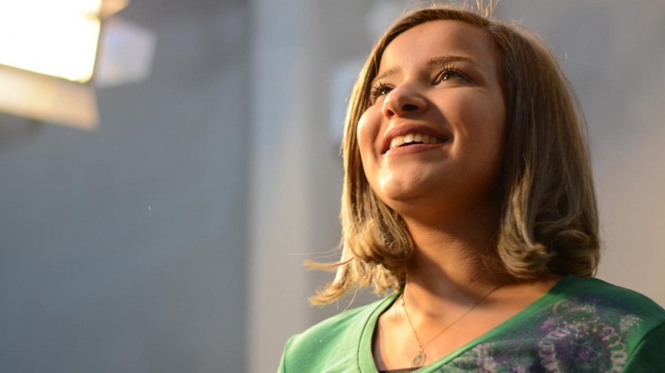 Souzda rehearses a song she helped write for the album, which features refugee performers.