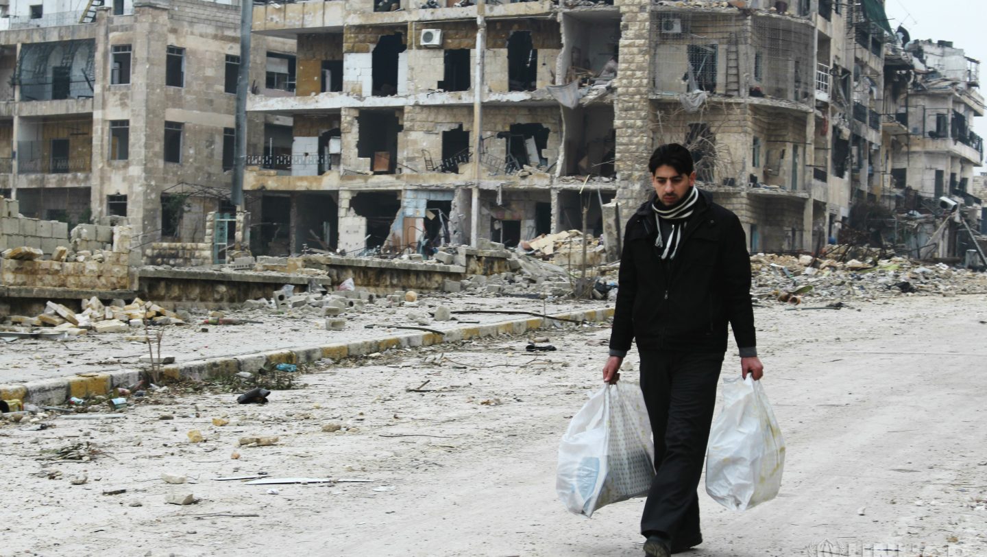 People from East Aleppo visits to check on their damaged houses