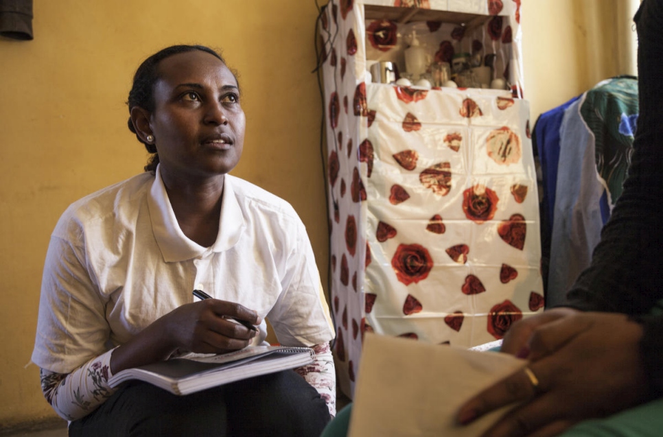 Semhar, a refugee volunteer from Eritrea, visits an urban refugee in Addis Ababa, Ethiopia