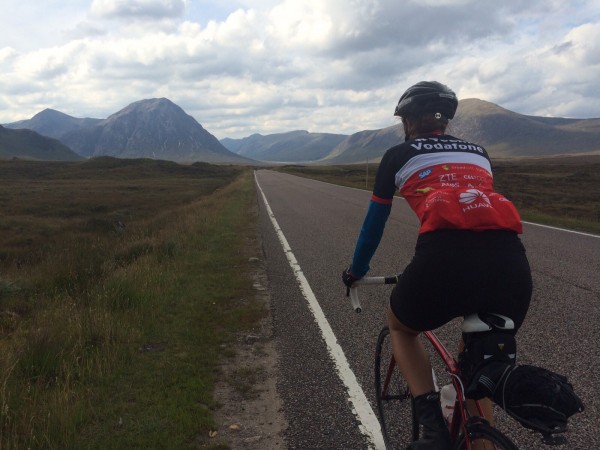 Photo of Jackie Strecker, Learn Lab Manager, biking through Scotland.