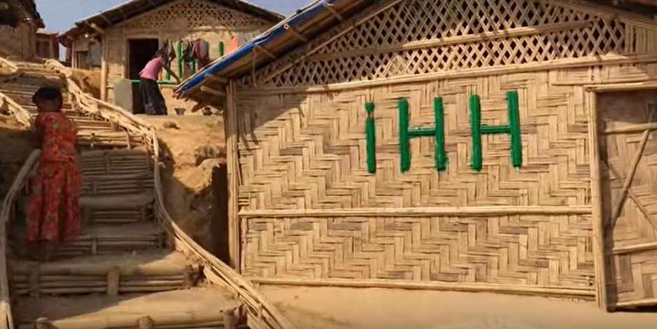 House made out of bamboo in a camp setting.