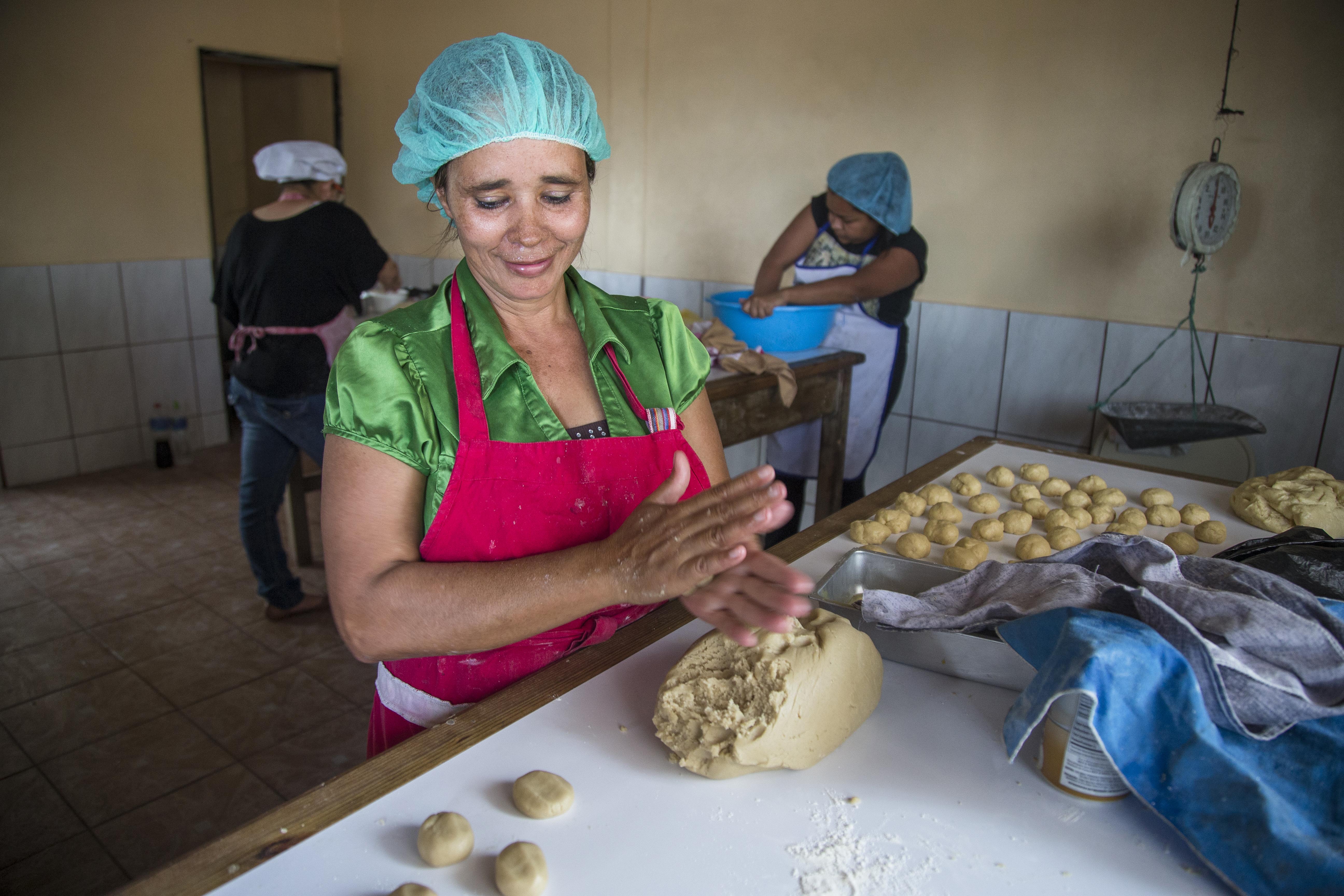 A lady makes bread