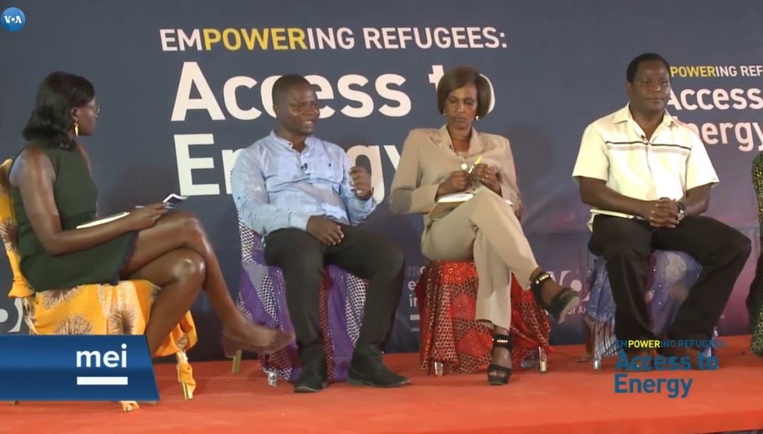 Four people sit on a panel