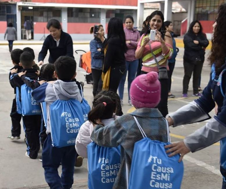 Kids in line outside at school.