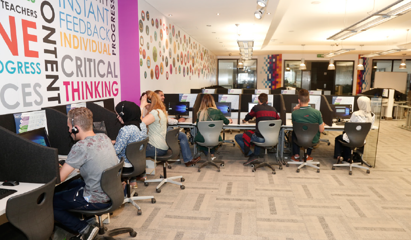 Young people in a classroom with computers.