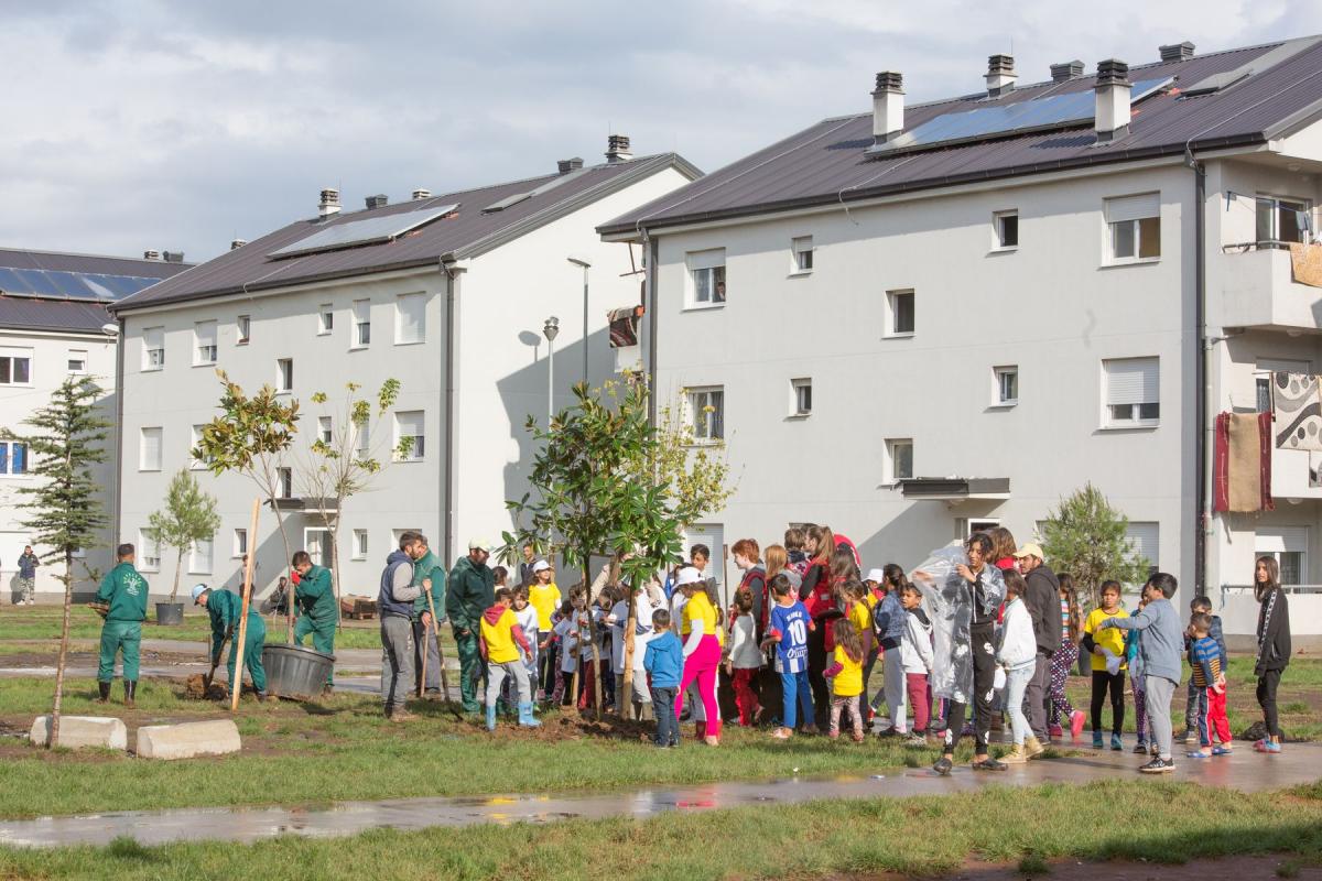 People outside of a housing unit.