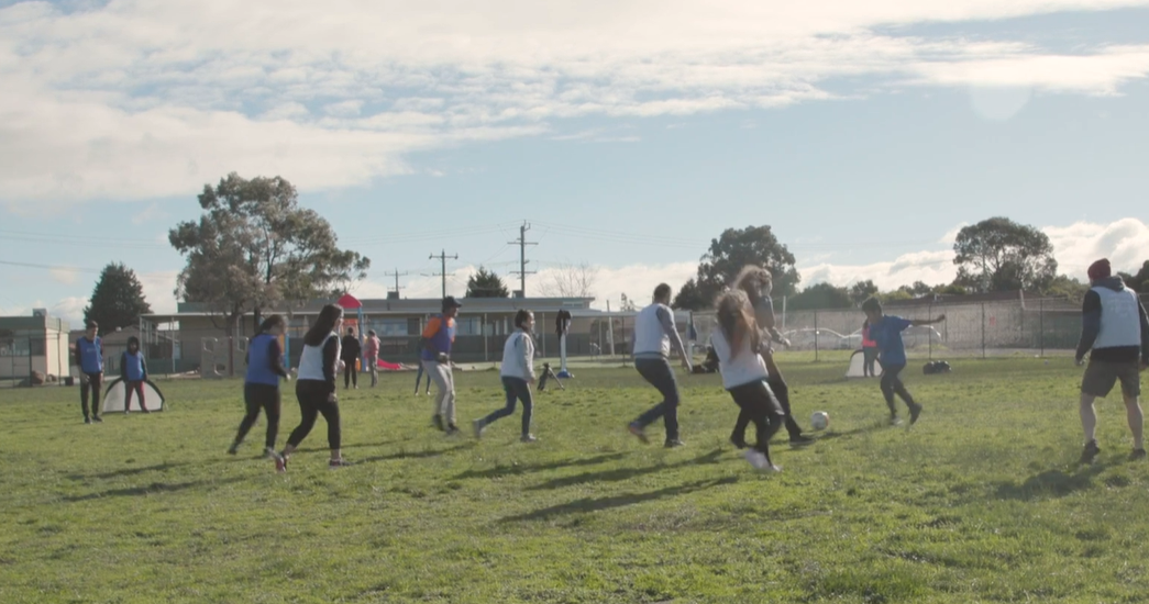 Kids playing football.