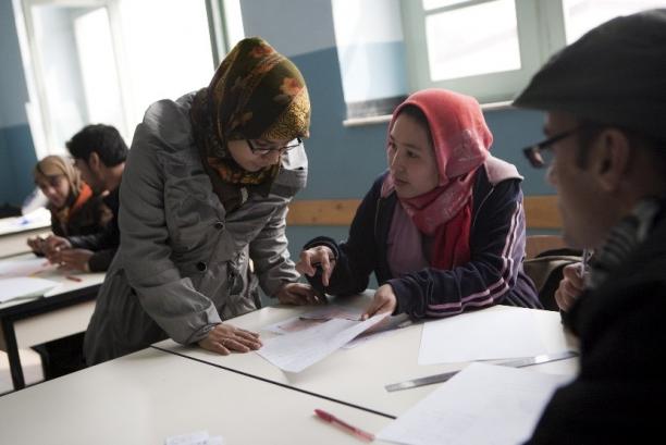 Two refugee women participating in a training. 