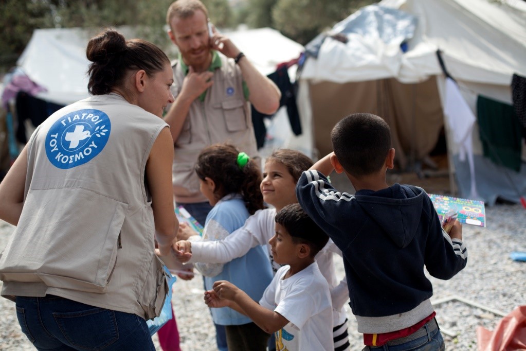 A woman from MdM Greece playing with refugee children in Kara Tepe camp in Lesvos 