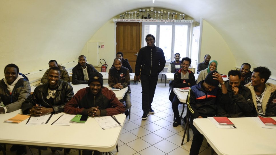 Resettled Sudanese refugee Alfatih (second on the left) attends French class.