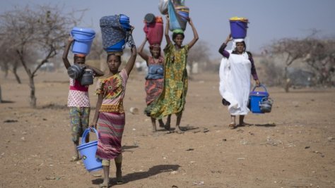 Malian refugees collect aid items at Goudoubo camp, Burkina Faso, February 2020.