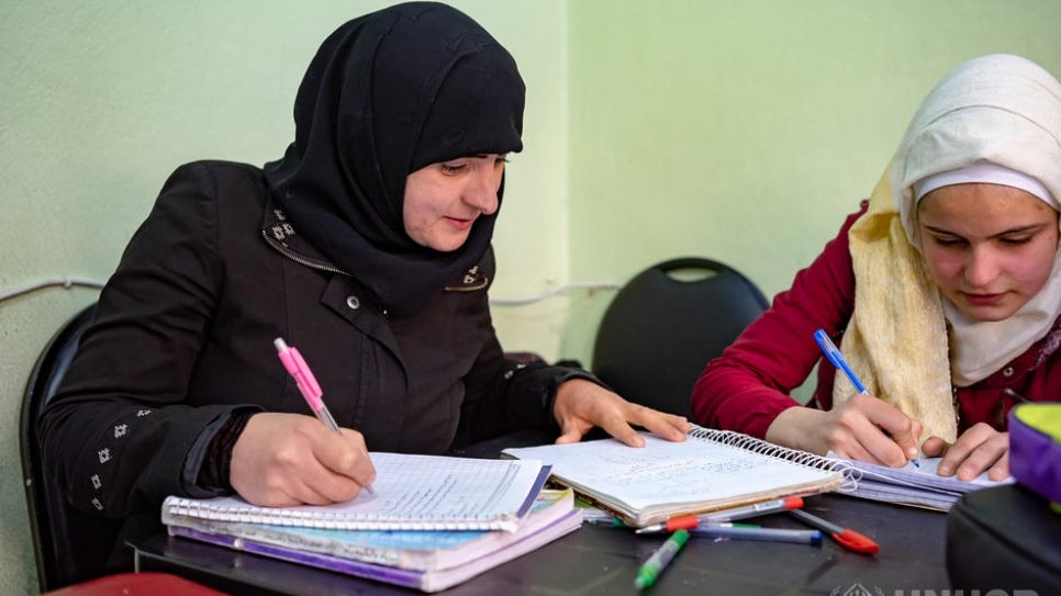 "I felt powerful with the knowledge I gained, I overcame the felling of weakness in front of my kids."

Syrian mother of four, Elham, prepares for her next exam in a class at one of the UNHCR-supported community centres in Aleppo.