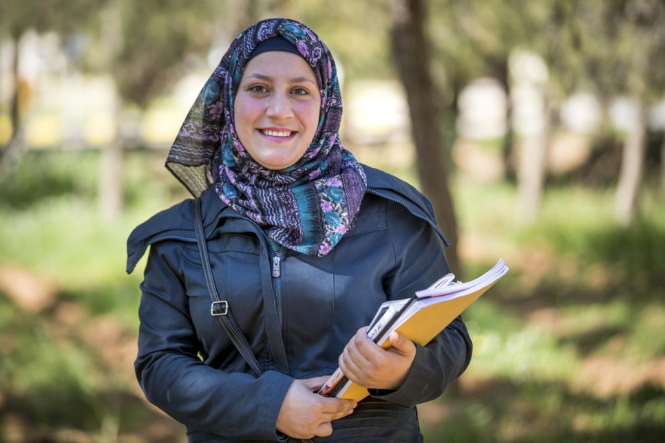 Ala'a Alhmadi, 22, fled Dara'a, Syria, in March 2013 with her family. They settled in Zaatari camp, Jordan. Ala'a is in her third year of Educational Sciences at nearby Al-Albayt University. She is married and has a 10-month old daughter.

"I was studying media and journalism at Damascus University before the war. Here in Jordan, I spent two years with no access to formal education. I can't even start to describe how I felt when I received the DAFI scholarship. A year later, I got married and today I am a mother. Perhaps the scholarship was the key to good fortune!" she says.  

"For the past three years, I've been volunteering for Doctors Without Borders as social researcher and mental health supporter. We are achievers. This is the by-product of our difficult life. It gives us extra motivation."

"Life in the Zaatari refugee camp is difficult. I hope to complete a master's degree and perhaps a PhD. My wish is to become a university professor. But I am scared that I might have to stay in this camp, or that I will not be able to obtain financial support to complete my studies."
