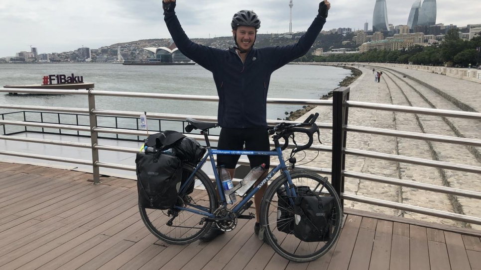 Theo Foster arrives at the Caspian Sea after cycling 3,500 miles overland from Geneva, Switzerland, to Baku, Azerbaijan.
