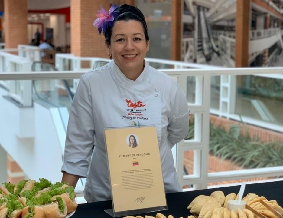 Yilmary, a Venezuelan refugee living in São Paulo, has managed to keep her business, a food stall serving Venezuelan specialties, afloat during the pandemic.