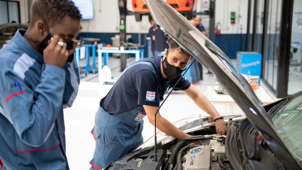 Yemeni refugee, Waleed (right), 28, takes part in a hybrid mechanics class as part of his diploma at Luminus Technical University College in Amman, Jordan. 