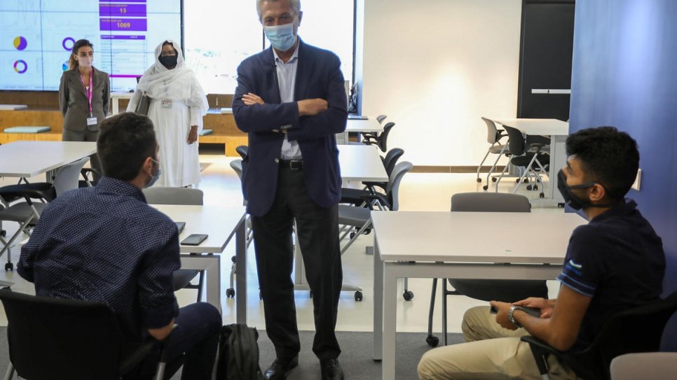 UN High Commissioner for Refugees Filippo Grandi talks to refugee and Jordanian students at Luminus Technical University College in Amman.