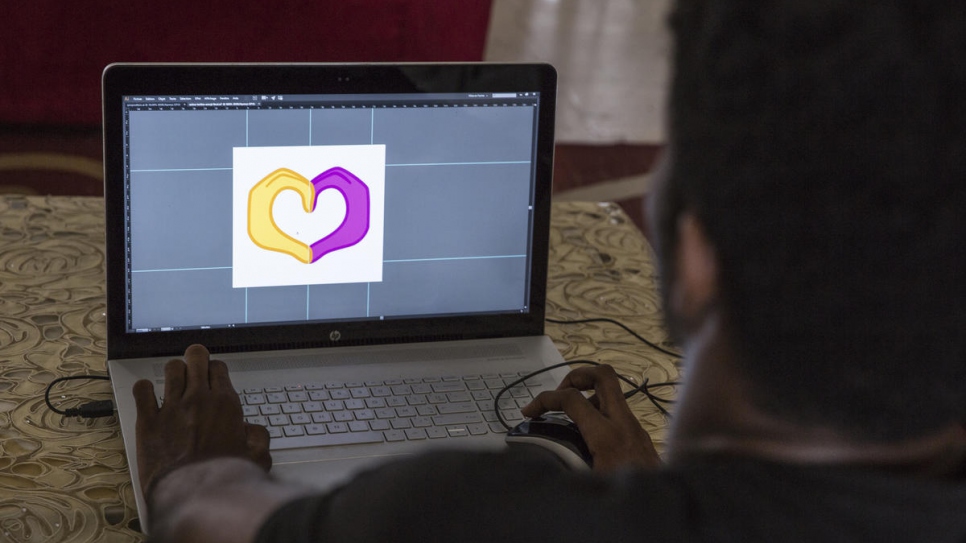 Ivorian graphic designer O'Plérou puts the final touches on his emoji for World Refugee Day 2020.