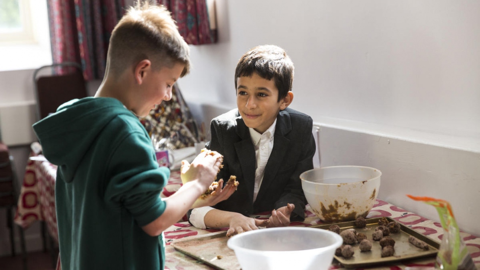 Nine-year-old Shadi Alchik (right) and his friend prepare Syrian food, in Cardigan. Shadi has lived in Wales for over a year and speaks fluent Welsh.