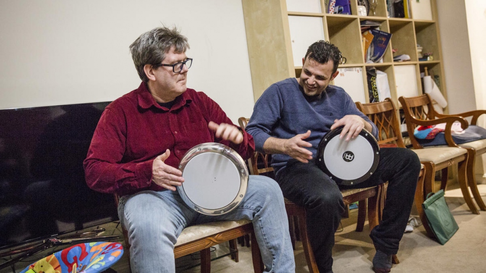Hani Arnout (right), 34, plays drums with Steve Chapman, at the Arnout home in Ottery St Mary, Devon, south-west England. Hani and Steve have built up a friendship around a shared love of drumming.