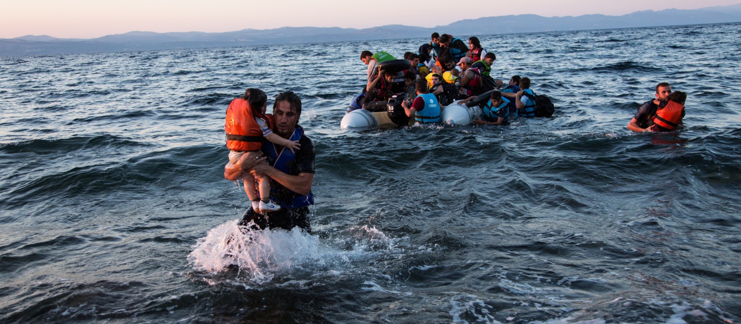 A group of Syrian refugees arrive on the island of Lesbos after travelling in an inflatable raft from Turkey, near Skala Sykaminias, Greece.