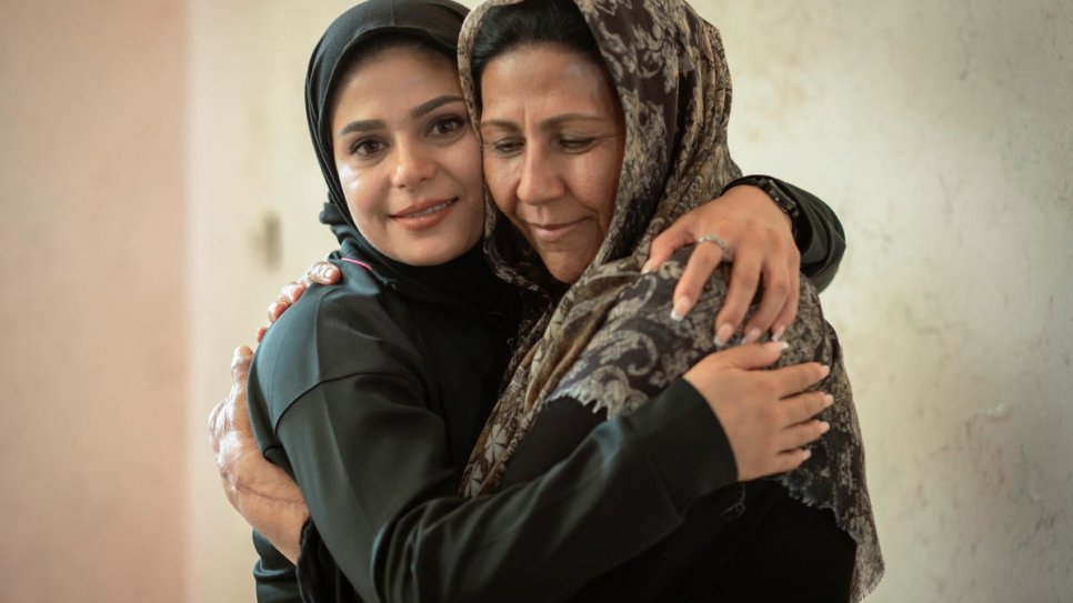 Rozma hugs her mother, Pari, at her home in Shiraz.