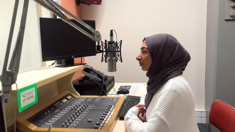 Twenty-year-old former Iraqi refugee and radio presenter Narjis Al-Zaidi shares information about COVID-19 with her listeners in Wellington, New Zealand.