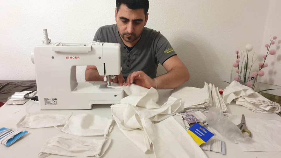 Rashid Ibrahim, a tailor from Syria, now living in Seddiner See near Potsdam, Germany, is sewing face masks to support his local community in the fight against the Corona virus