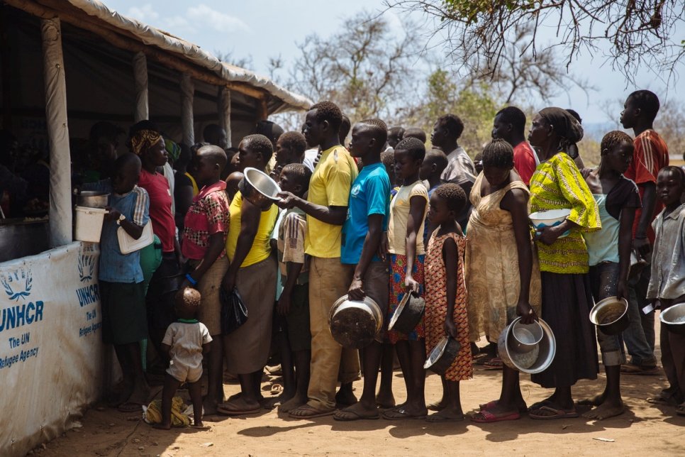 Uganda. South Sudanese refugees queue for food the Imvepi reception centre