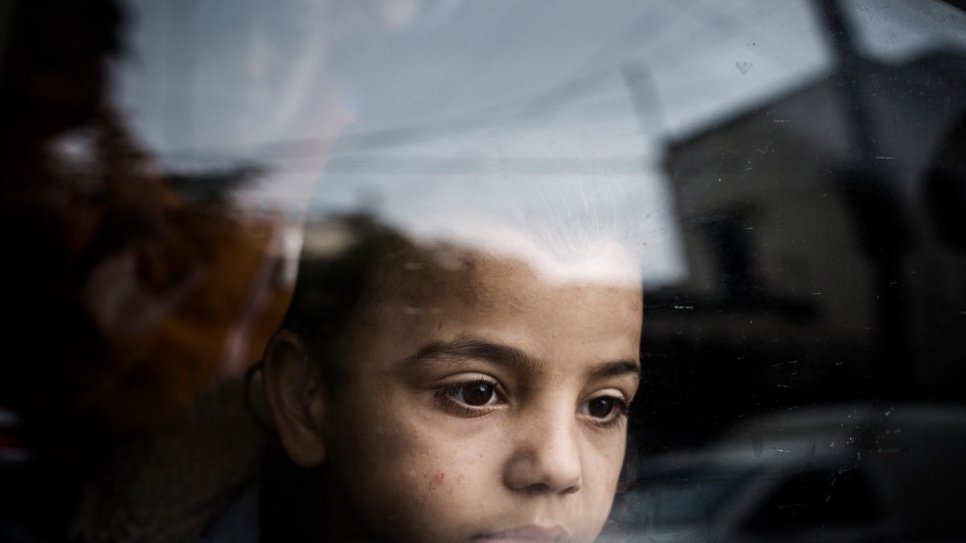 Mohammad gazes out of a window on the outskirts of Beirut in Lebanon.