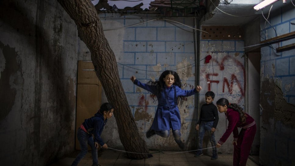 Naamat jumps rope with some of her neighbourhood friends.