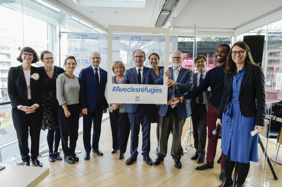 In early-November 2019, UNHCR staff attended a press launch at Gare de Lyon in Paris with partner organisations collaborating on the Solidarity Train #WithRefugees project. France's national railway company, SNCF, and the Inter-ministerial Delegation for the Reception and Integration of Refugees in France, DiAir, are working with UNHCR to facilitate and promote the journey of a train that will travel across France to Geneva, arriving for the launch of the Global Refugee Forum in December. The aim of this project is to highlight best practice on the integration of refugees and put forward another way to view forced displacement. Inside the train, an exhibition open to the public will educate them about the history of refugees, causes of displacement and some of the global solutions. One carriage will be for conferences and another for informal exchanges at the bar.