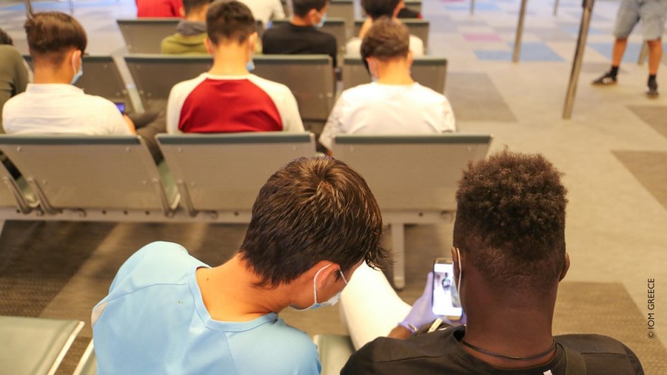 A group of unaccompanied children wait to board a flight from Athens to Lisbon, under an EU relocation scheme.