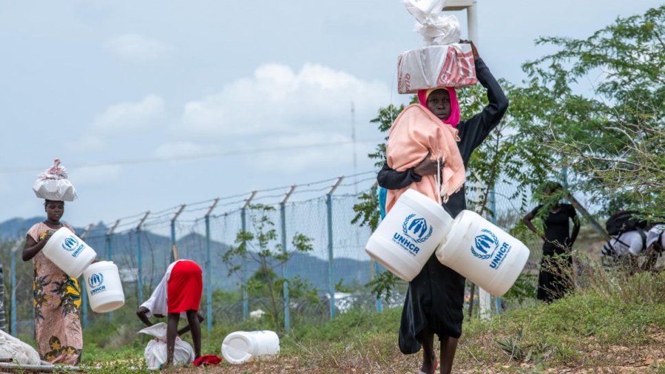 Refugees at Kalobeyei Settlement in Kenya receive two-month rations of soap, jerrycans and firewood.