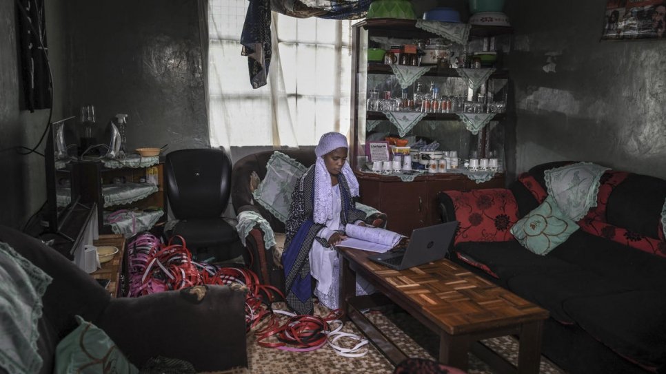 Twenty-year-old stateless Shona woman, Nosizi Reuben, revises on her laptop at home in Kinoo, Kenya.
