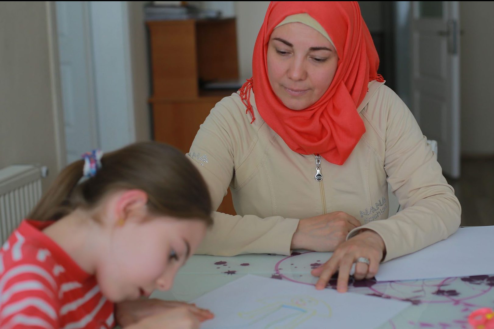 Darie Alikaj fled barrel bombs and mortar fire in Syria, leaving behind her job as a microbiologist. Now she mirrors a wider world of refugee survival in Turkey.