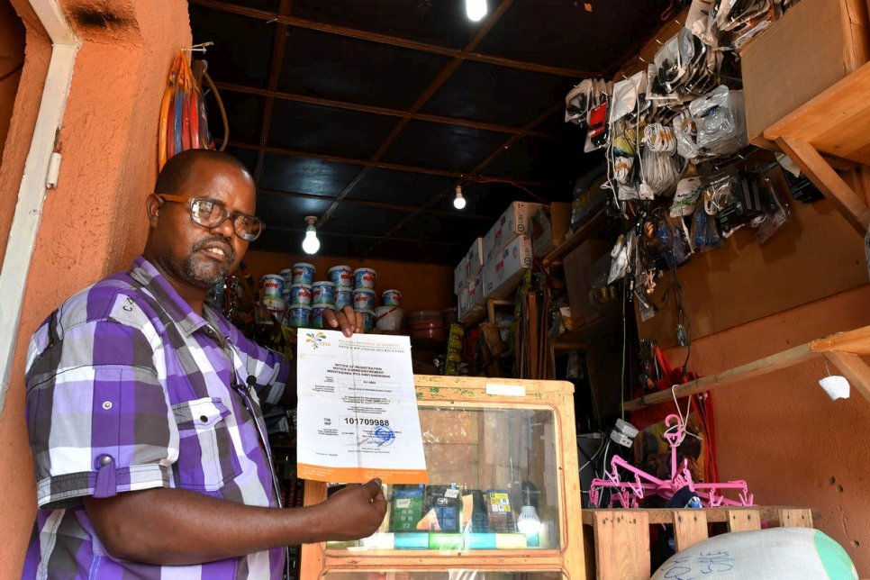Rwanda. Somali refugee shop owner thriving thanks to integration