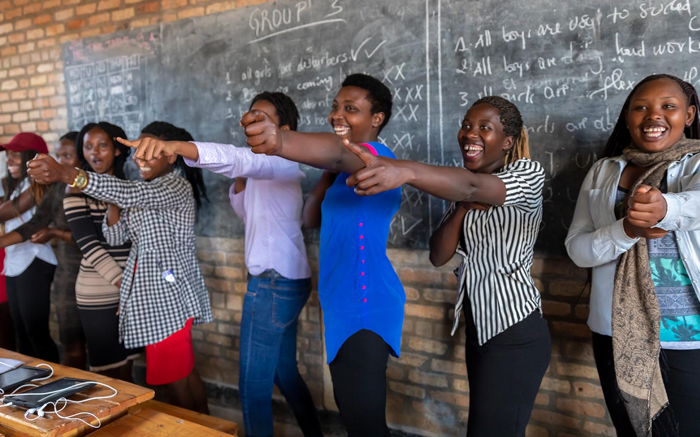 Refugee students from the Democratic Republic of the Congo participate in the Iteme Programme in Huye, Rwanda, which helps refugees and host community students improve their English and math which will increase their chances of being admitted in higher education programmes. © JULIA CUMES