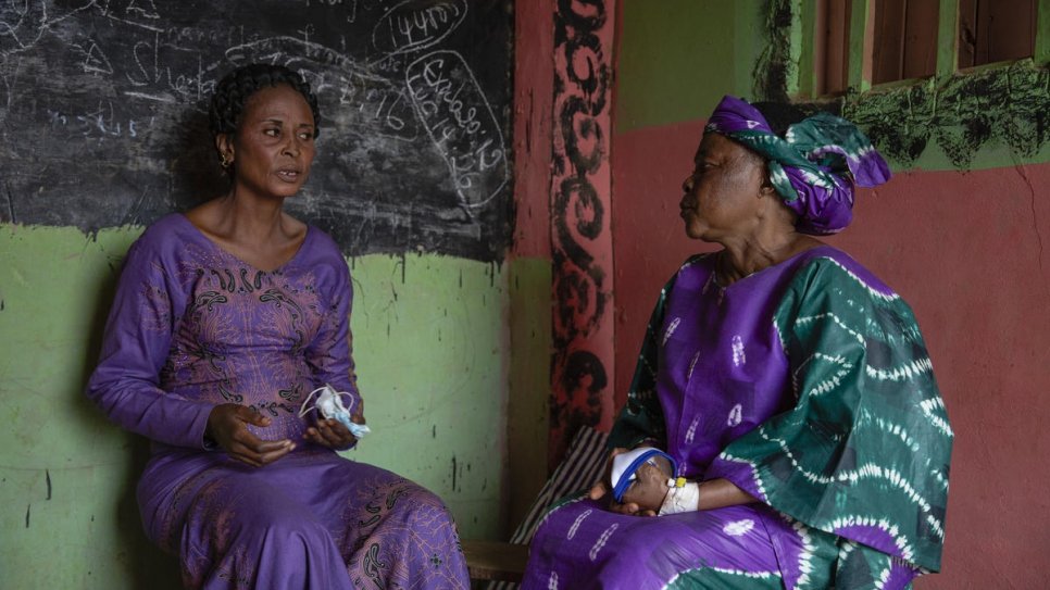 Ntahobari Nikuze (left), a Congolese refugee and survivor of violence speaks with the Nansen Refugee Award regional winner for Africa, Sabuni Francoise Chikunda in Nakivale settlement, Uganda.