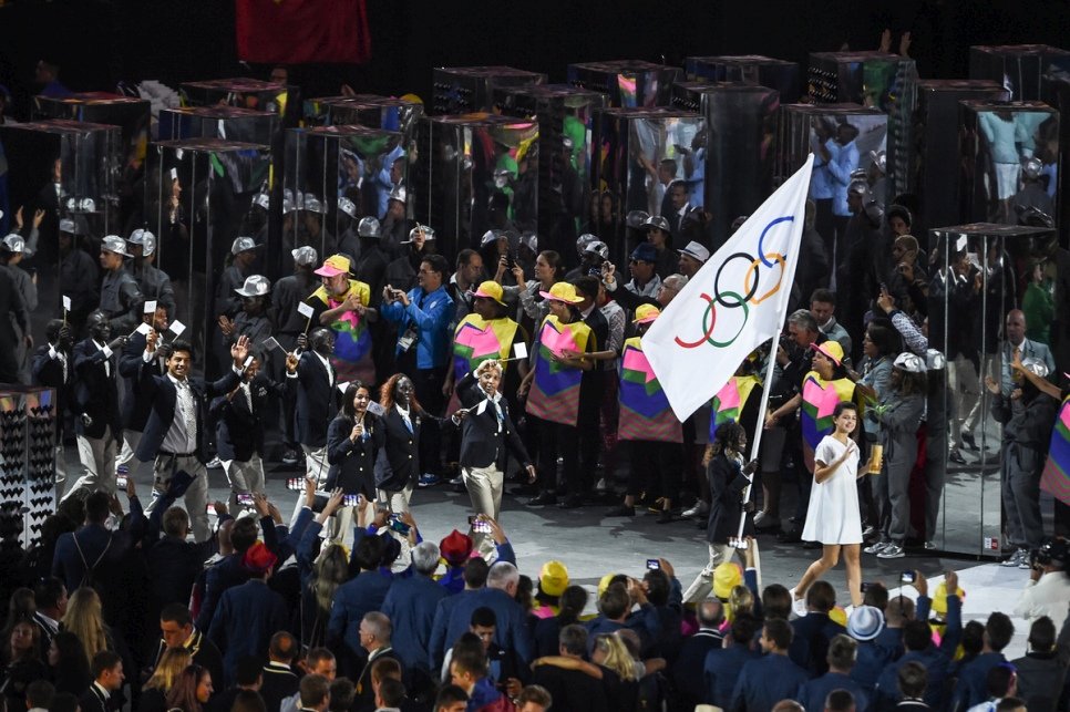 Rose Lokonyen carries the Olympic flag and leads the Refugee Olympic Team during the Opening Ceremony of the 2016 Games in Rio.