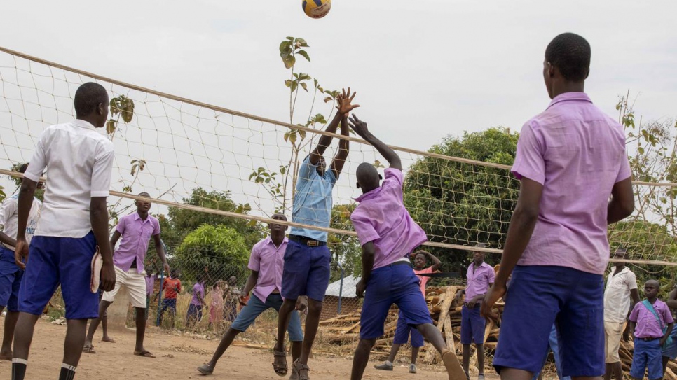 Refugee and South Sudanese students play volleyball between classes in Makpandu settlement, South Sudan.