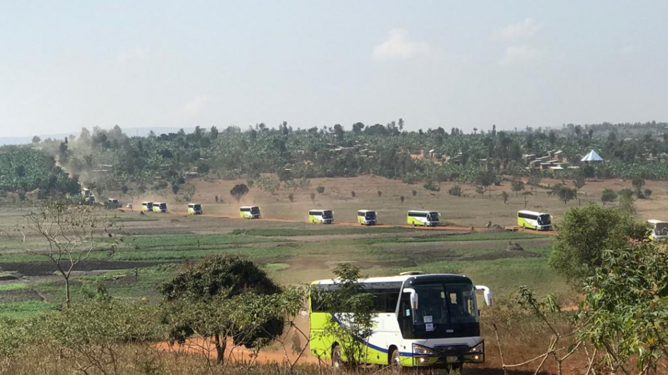A convoy of buses carrying Burundian refugees departs from Mahama camp, Rwanda. 