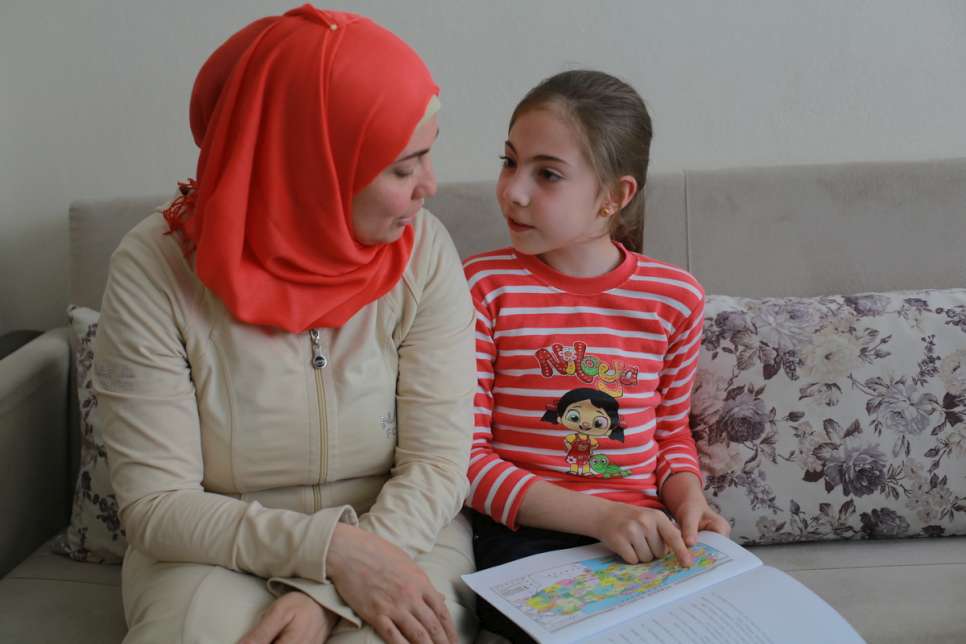 Nine-year-old Mayas (right) is in fourth grade at a Syrian school in Turkey which has over 1,000 students. 