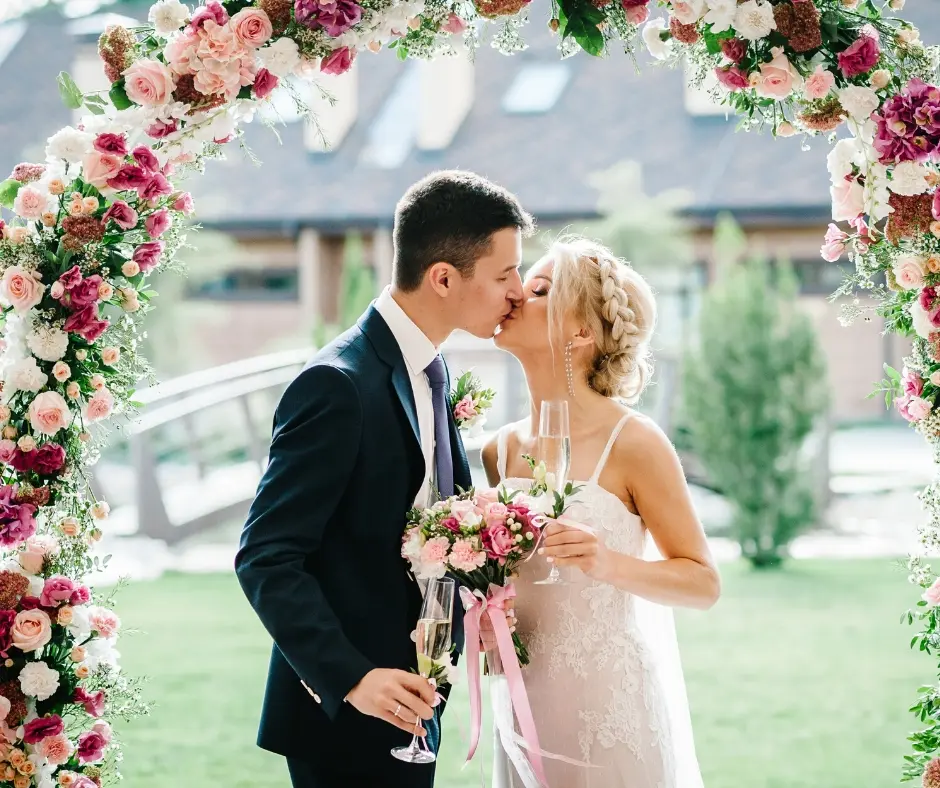 A couple kissing at their wedding