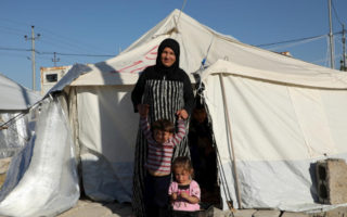 A Syrian refugee and her family prepares for winter